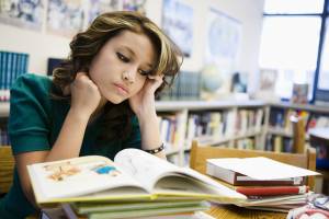 High School Student Studying in Library